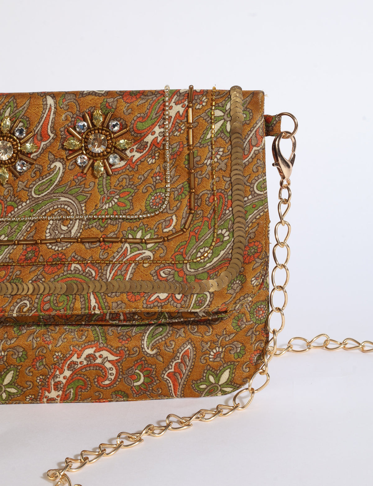 Embroidered evening bag with embellished fold-over flap, tassel detail, and detachable metal chain strap.