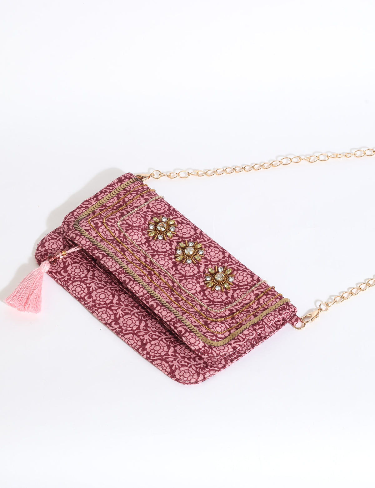 Embroidered evening bag with embellished fold-over flap, tassel detail, and detachable metal chain strap.