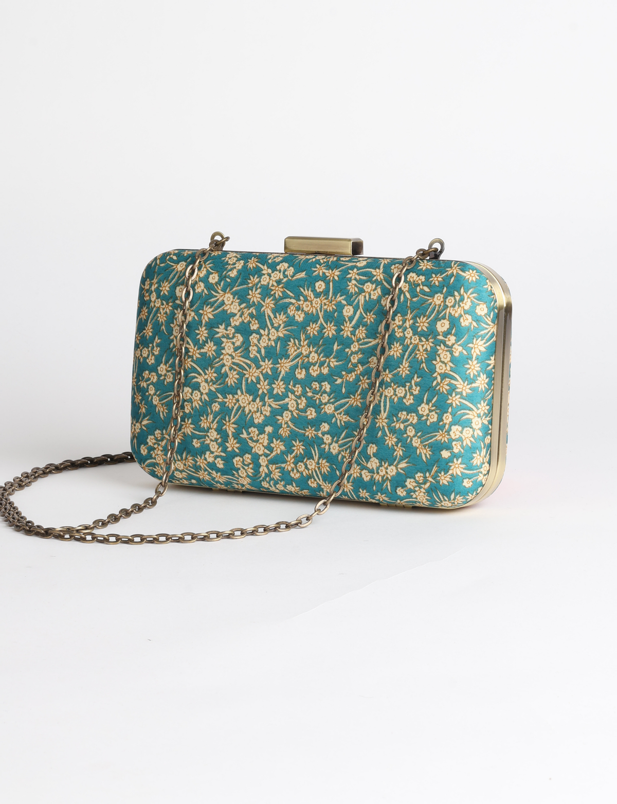 Structured box clutch bag featuring a rigid metal frame, secure clasp closure, detachable metal chain strap, and compact rectangular silhouette.
