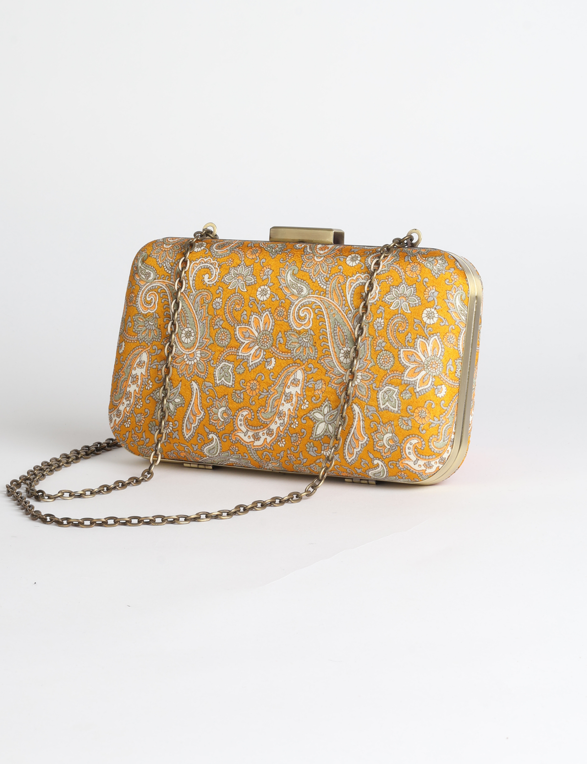 Structured box clutch bag featuring a rigid metal frame, secure clasp closure, detachable metal chain strap, and compact rectangular silhouette.