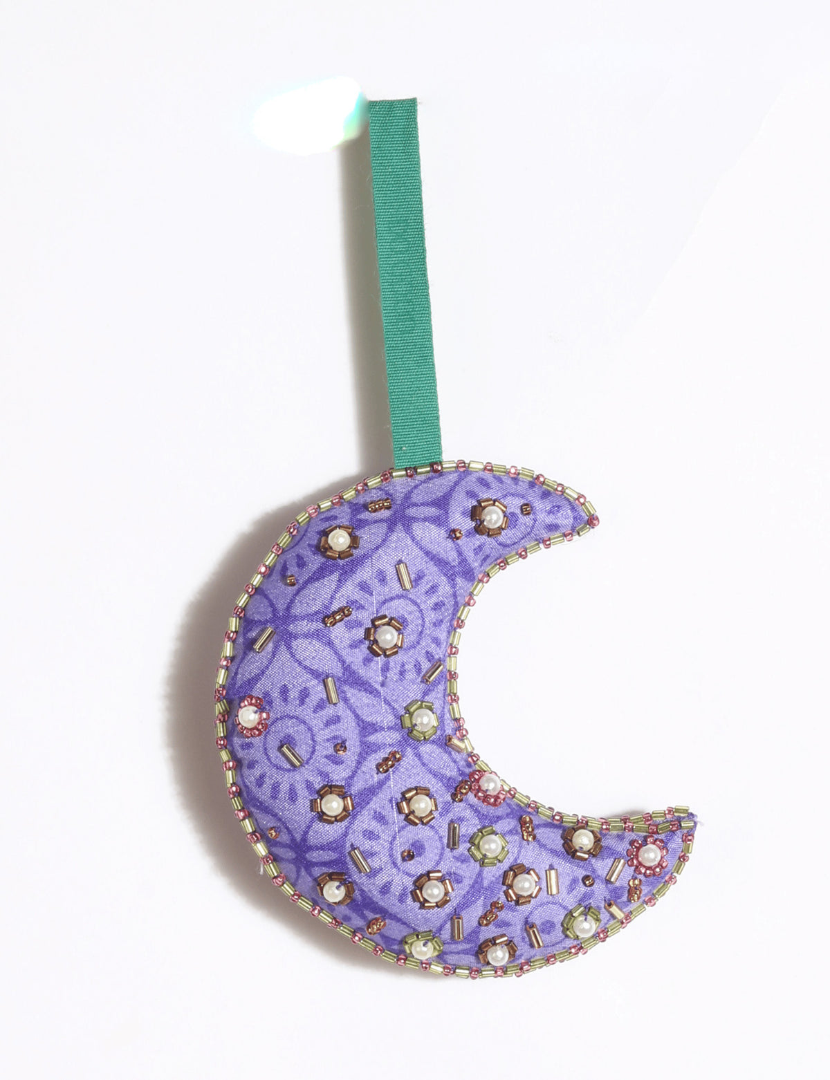 Cheer crescent moon festive ornament made from colorful upcycled sari fabric with Aari embroidery, donated beads and stones.