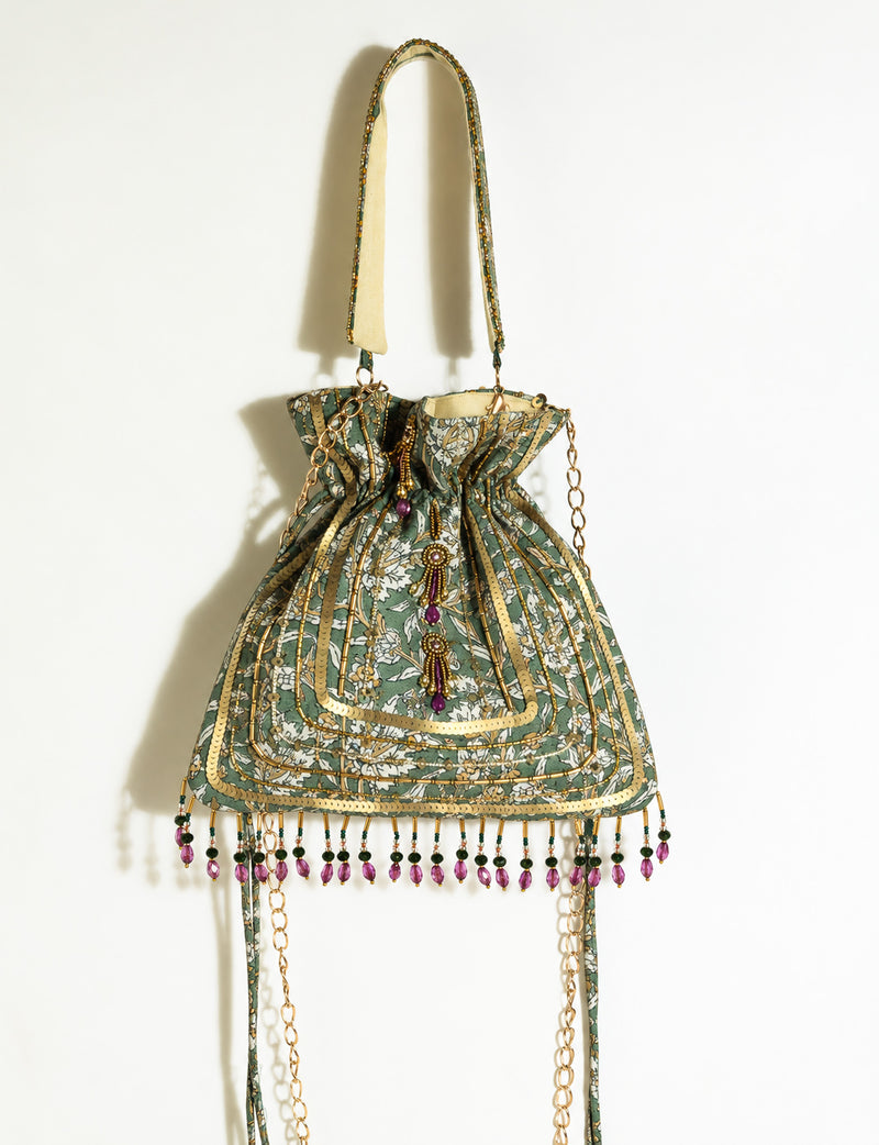 Embroidered DO GOOD potli bag made from upcycled sari fabric with tassel closure and detachable metal chain strap.