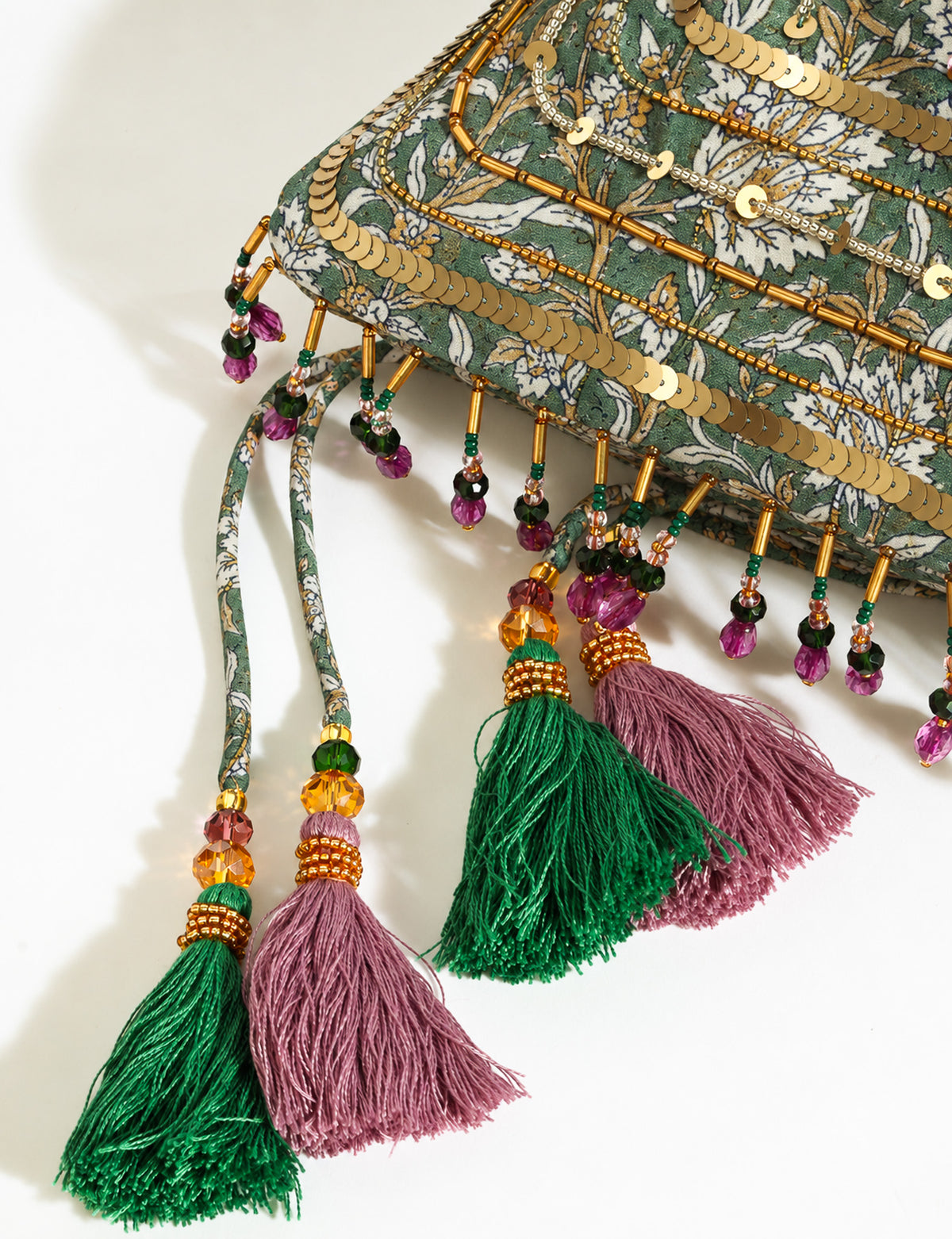 Embroidered DO GOOD potli bag made from upcycled sari fabric with tassel closure and detachable metal chain strap.