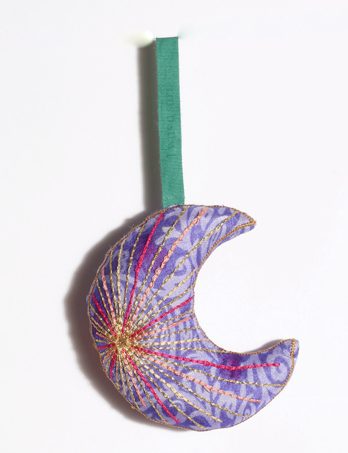 Timeless crescent moon Christmas ornament made from upcycled sari fabric with vibrant silk and metallic gold thread embroidery.