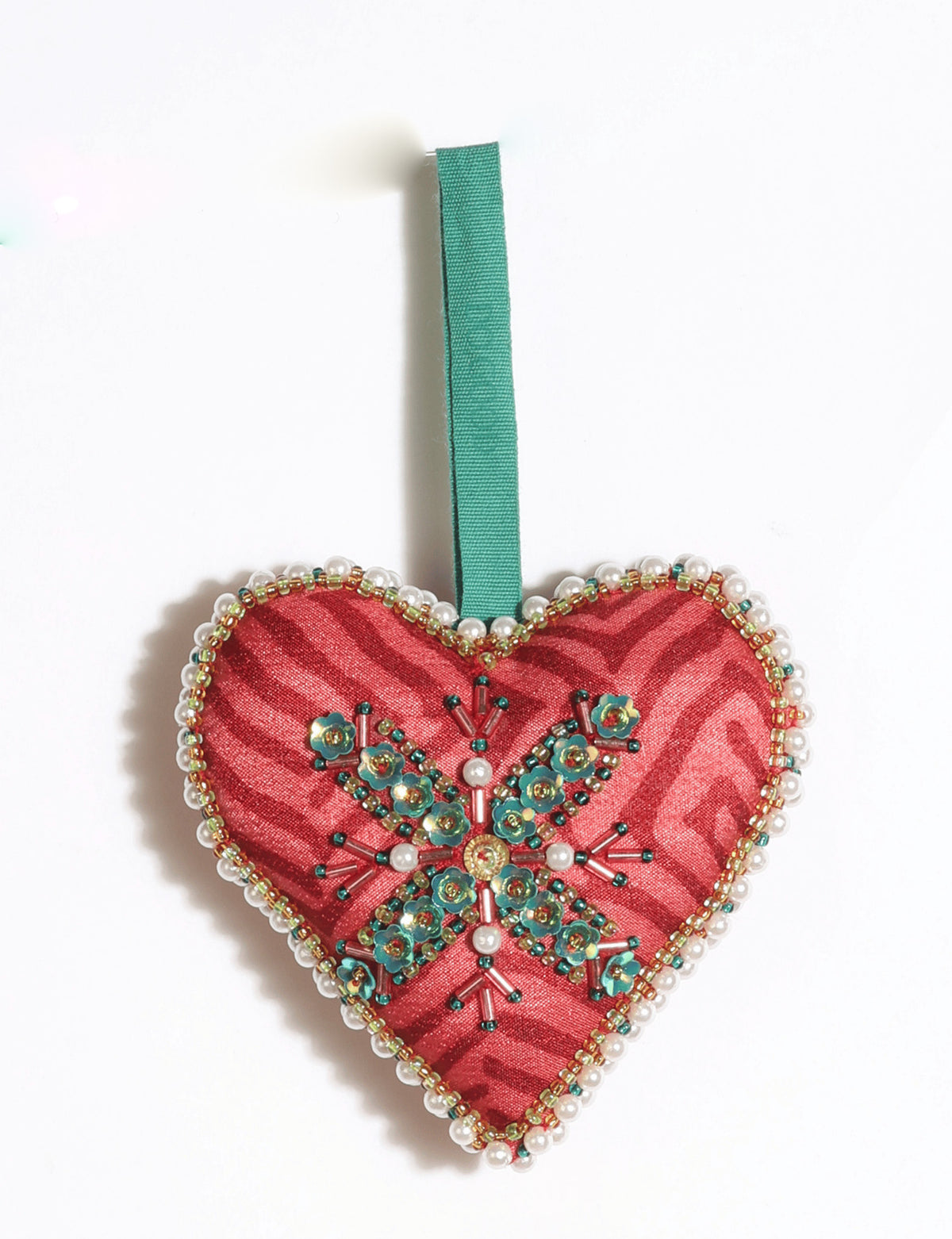 Cheer heart-shaped festive ornament made from vibrant upcycled saris with hand-embroidered Aari work, beads, sequins, and pearls.