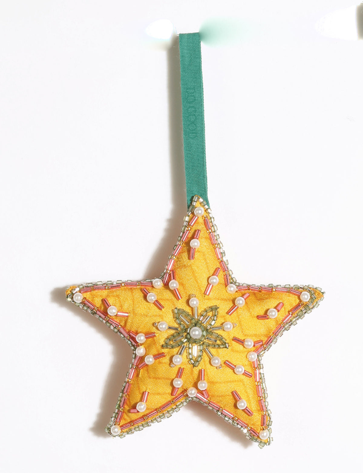 Cheer Star Ornament DO GOOD, crescent moon-shaped festive decoration made from vibrant upcycled saris with hand-embroidered Aari work, beads and stones.