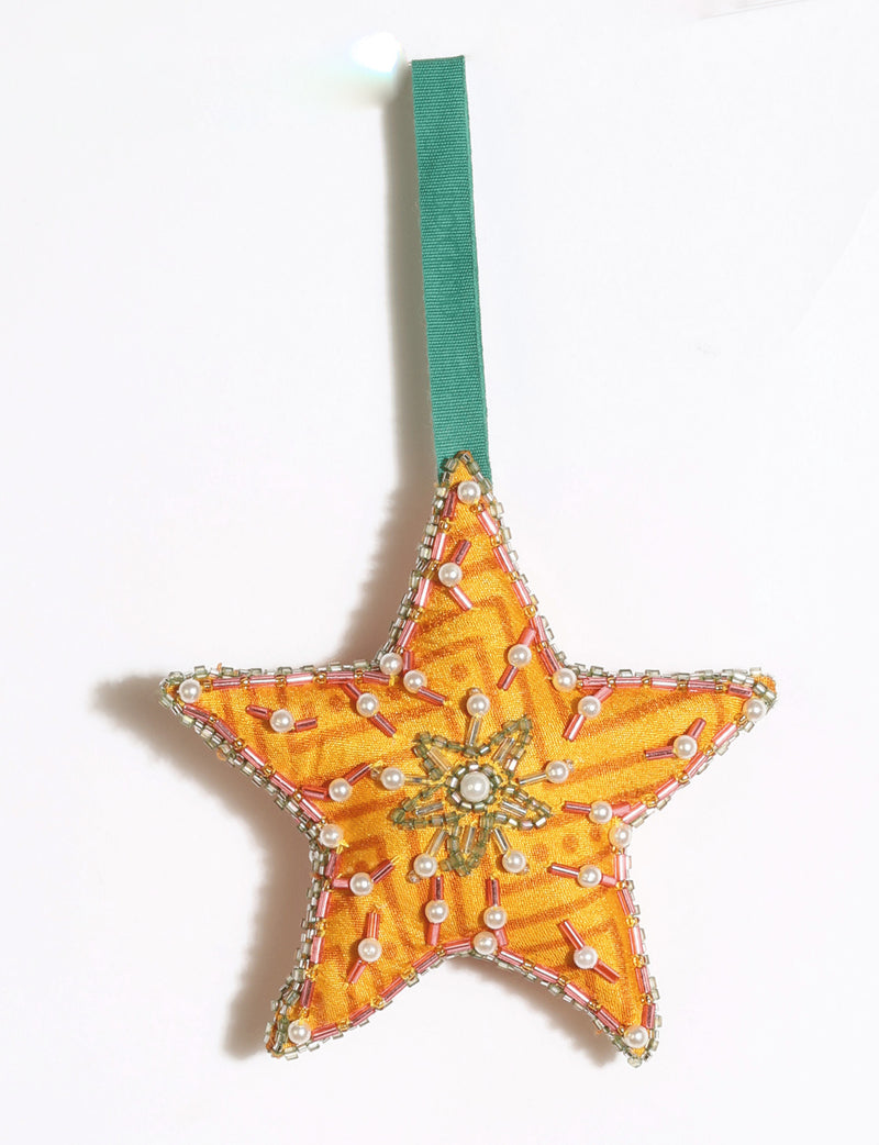 Cheer Star Ornament DO GOOD, crescent moon-shaped festive decoration made from vibrant upcycled saris with hand-embroidered Aari work, beads and stones.