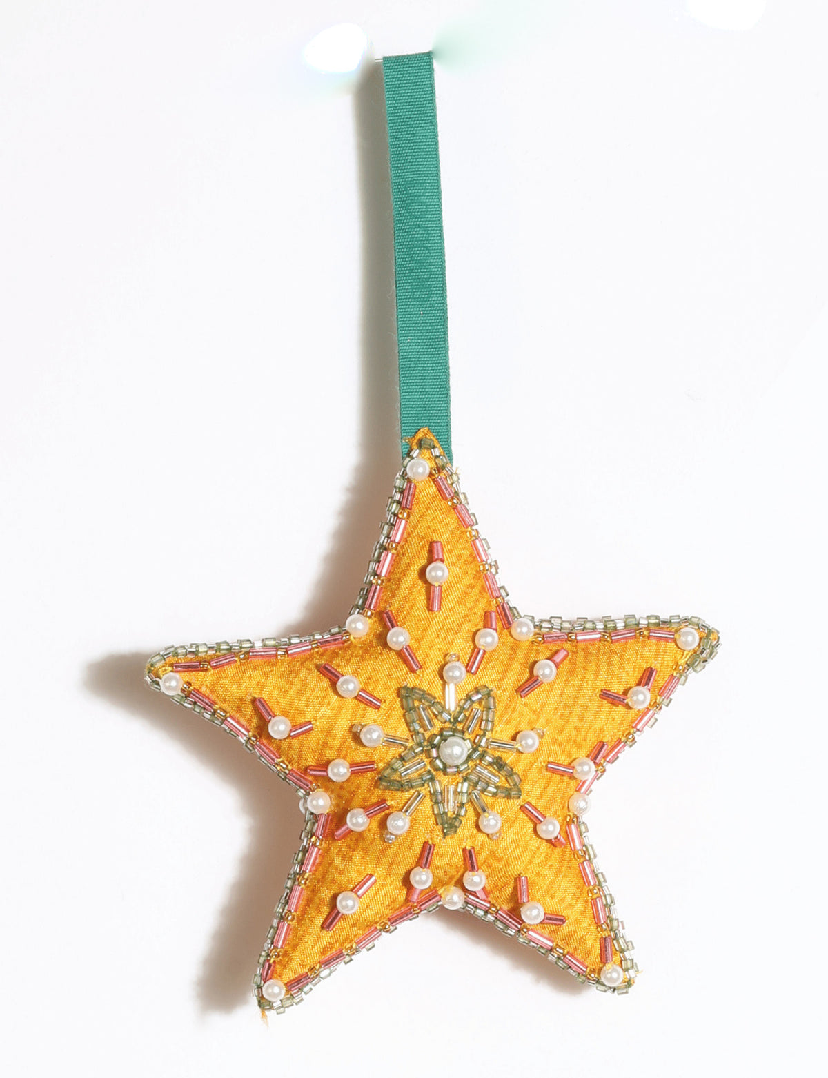 Cheer Star Ornament DO GOOD, crescent moon-shaped festive decoration made from vibrant upcycled saris with hand-embroidered Aari work, beads and stones.