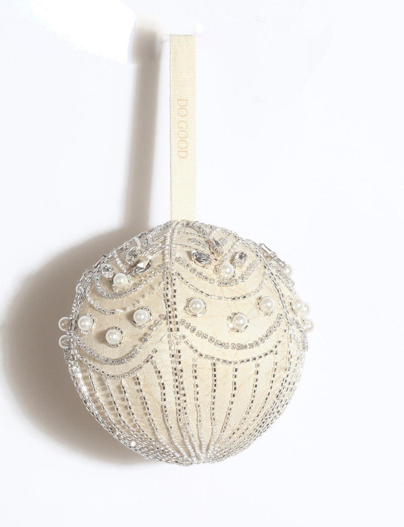 Silver embroidered Christmas ball ornament made from upcycled ivory and grey preloved saris, embellished with stones, sequins, pearls and glass beads.