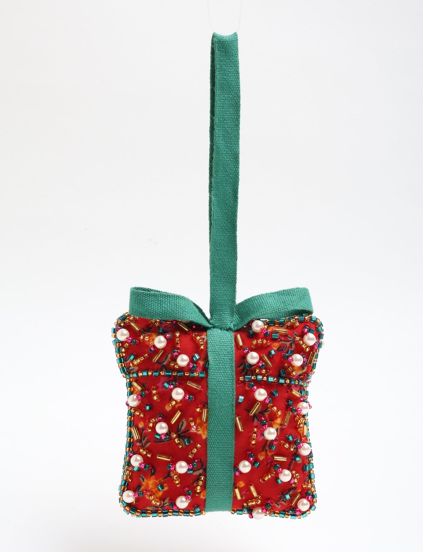 Upcycled bell-shaped Cheer Gift Ornament handmade from recycled sari fabric and decorated with pearls and sequins — an example of eco friendly fashion, recycled clothing, and circular fashion. A festive, earth-friendly decoration from Fair trade fashion and environmentally friendly clothing craftsmanship.