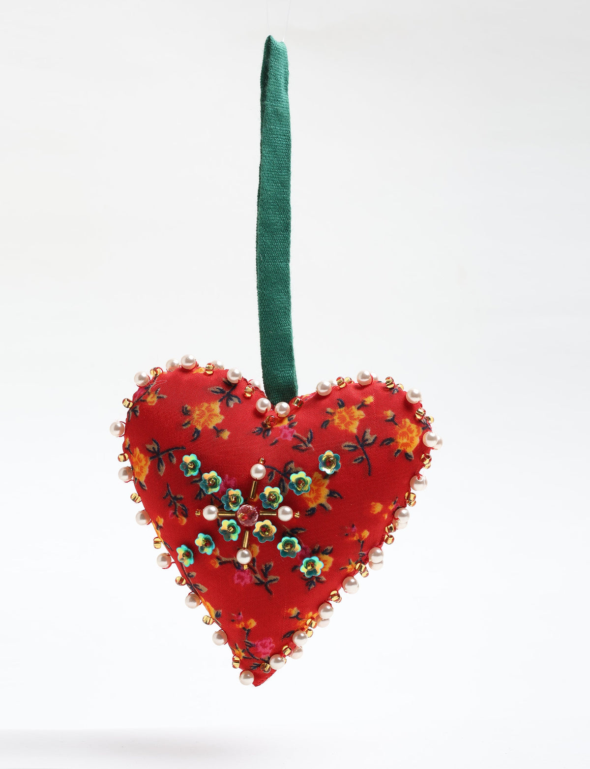 Red fabric heart ornament with yellow floral print, green and pearl bead embellishments, and green hanging loop