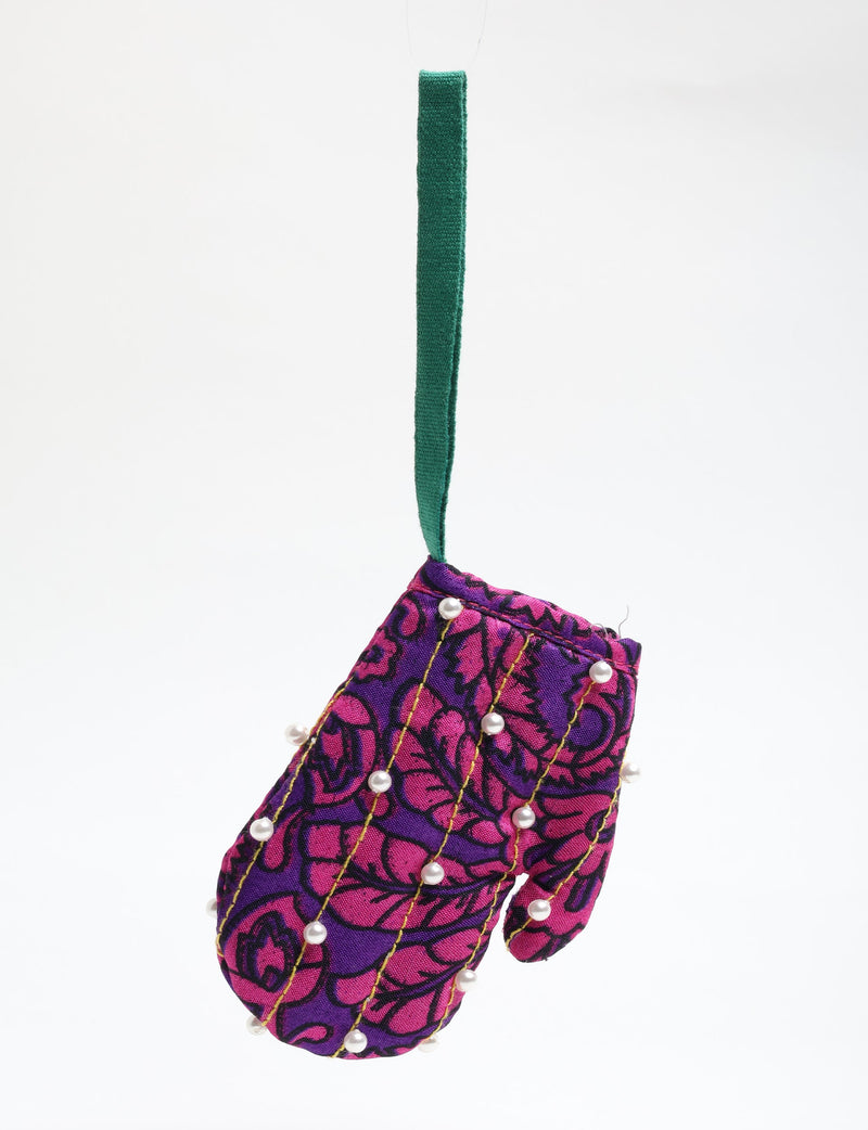 Purple and pink patterned fabric mitten ornament with pearl beads and green hanging loop, front view on white background