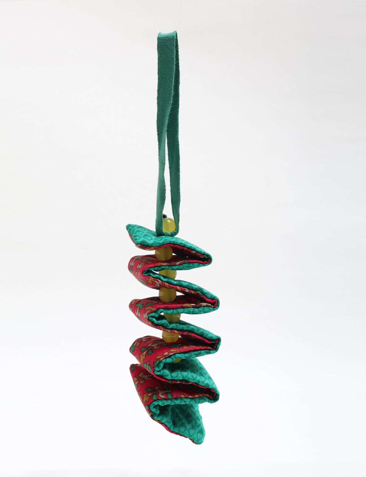 Hanging fabric candy cane ornament with alternating green and red patterned folds and yellow beads threaded through center