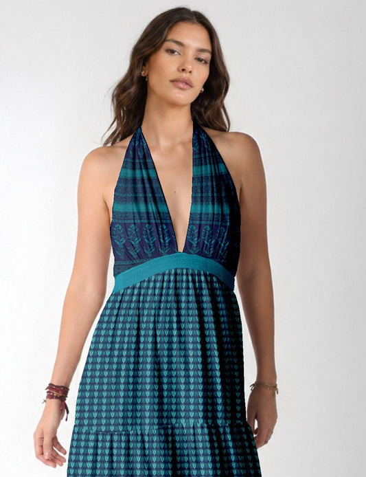 Model wearing maxi tiered dress with halter neck style