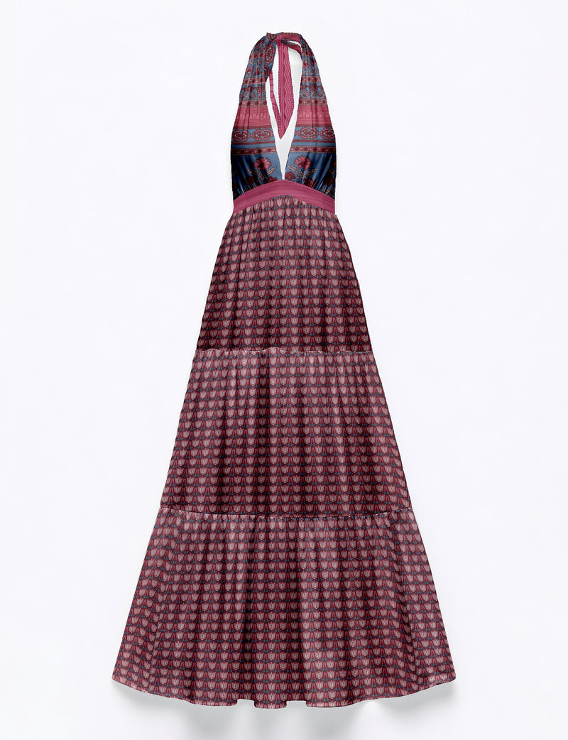 Maxi tiered halter dress with pink and navy leaf and floral patterns, deep V neckline, and fitted waist band, flat lay