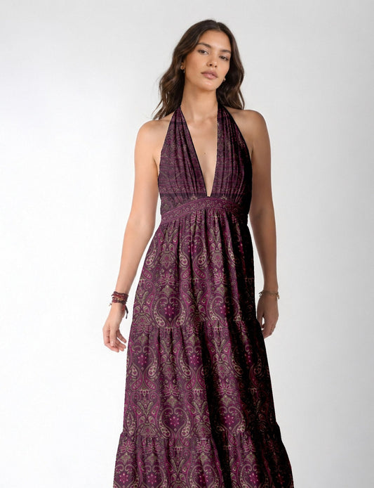 Model wearing maxi tiered dress with halter neck style
