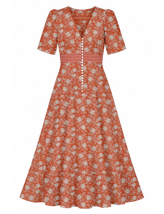 Maxi romantic dress with a fitted bodice, V-neckline, functional button placket, structured waist panel, short sleeves, and a softly flared ankle-length A-line skirt.