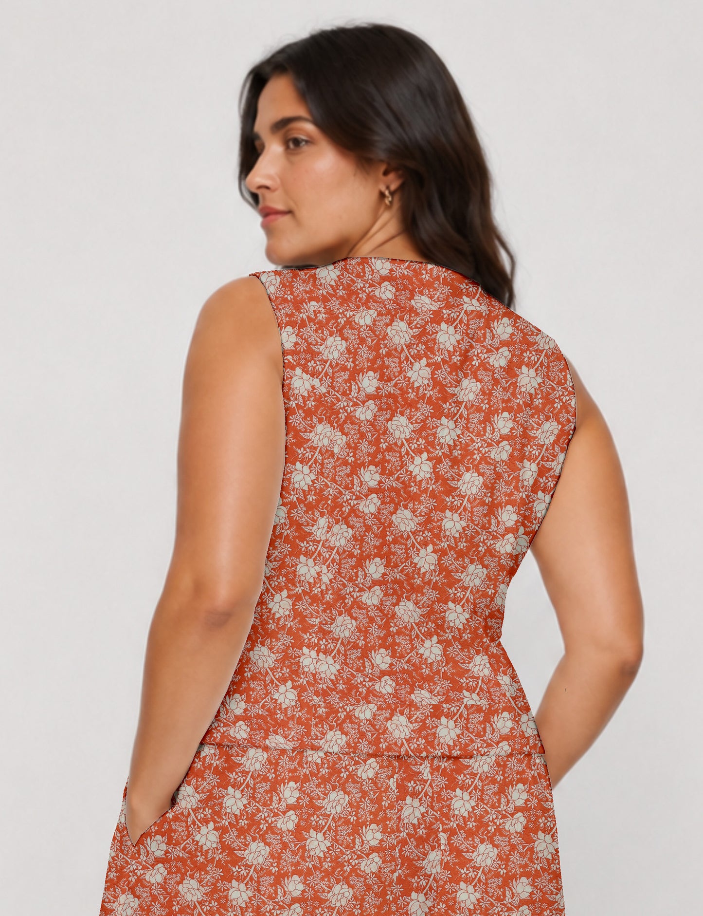Women's fitted waistcoat with V-neck, single-breasted button closure, tailored silhouette, and pointed hem in sustainable fashion.
