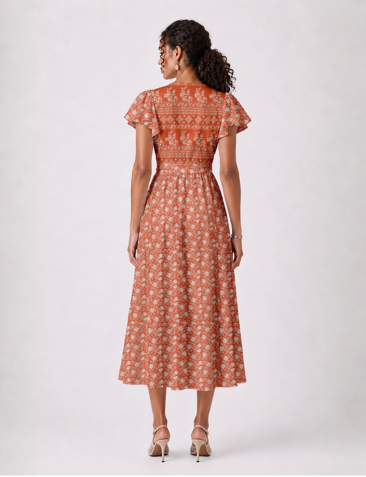 Elegant midi wrap dress with a V-neckline, adjustable waist tie, fitted bodice, and flared skirt for a timeless, flattering silhouette.