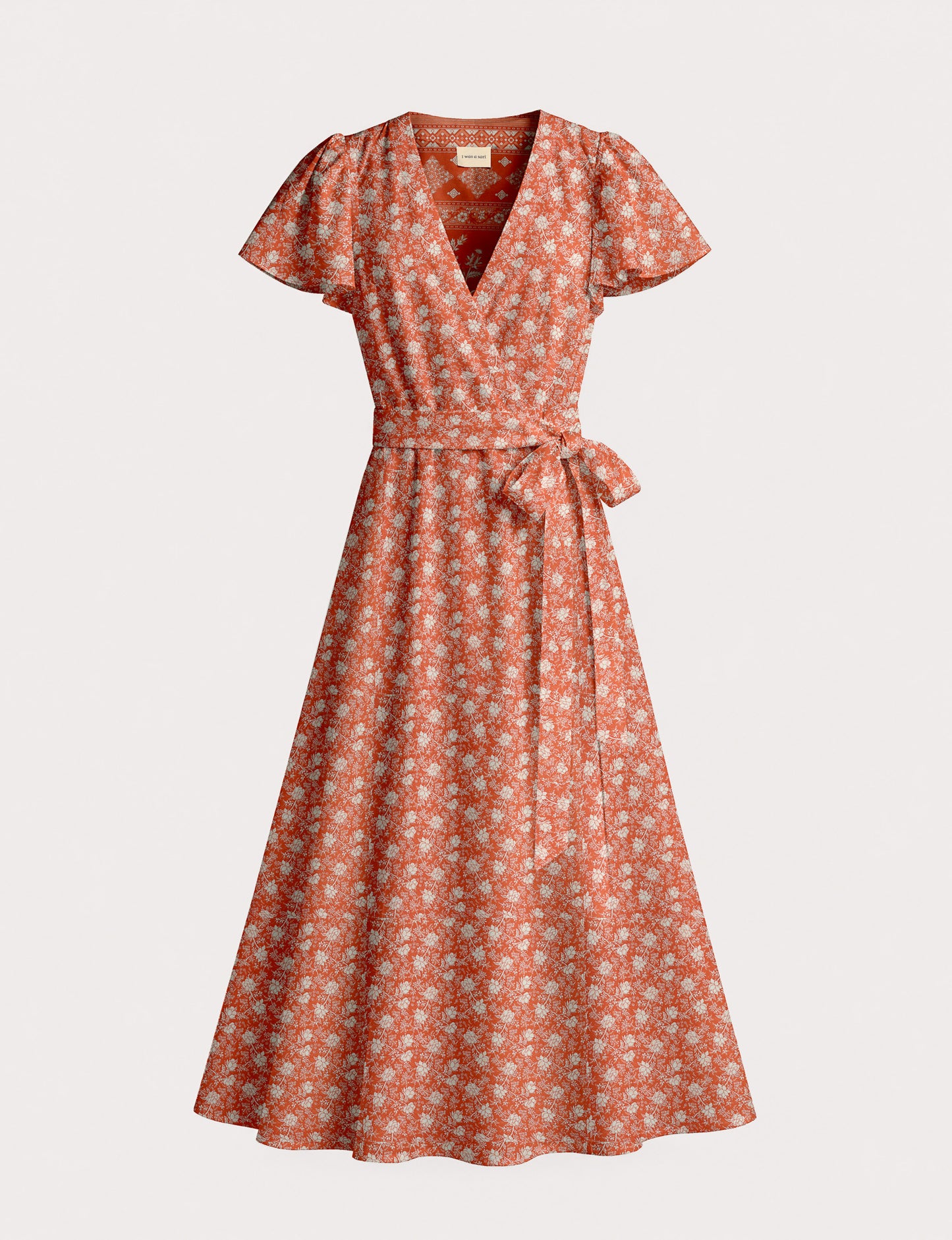 Elegant midi wrap dress with a V-neckline, adjustable waist tie, fitted bodice, and flared skirt for a timeless, flattering silhouette.