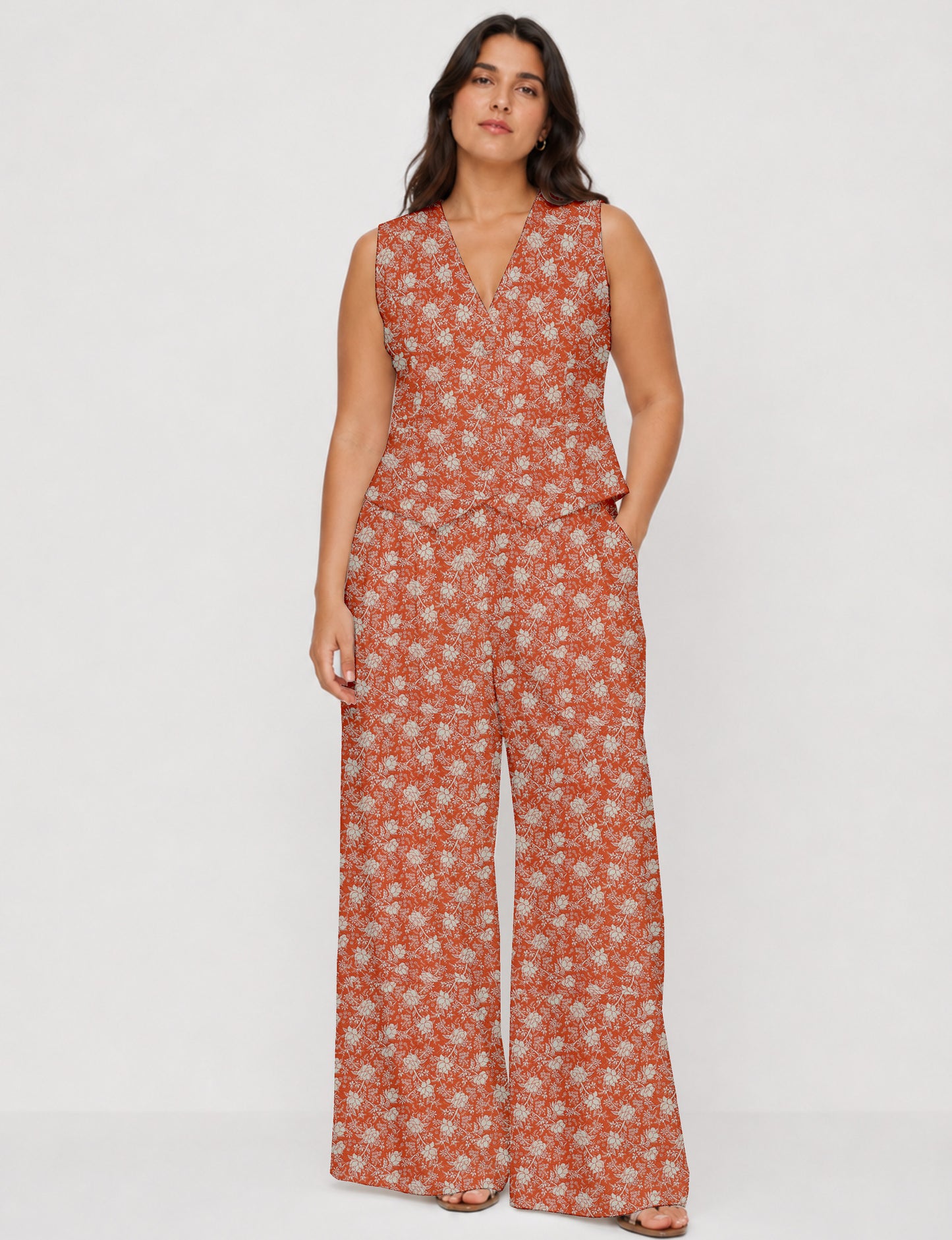 Women's tailored waistcoat set with a sleeveless V-neck button-front waistcoat and high-rise wide leg trousers in a coordinated matching outfit.