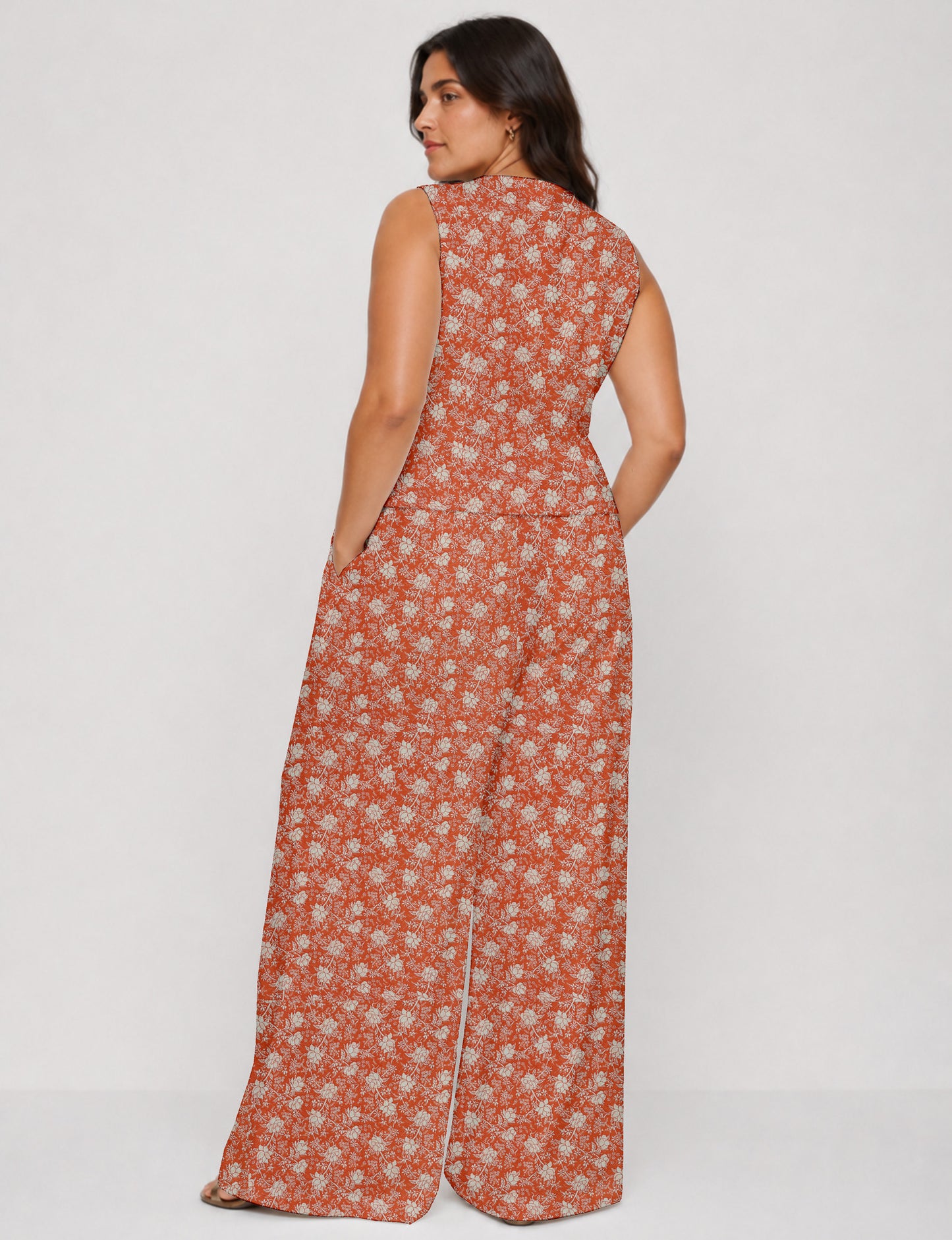 Women's tailored waistcoat set with a sleeveless V-neck button-front waistcoat and high-rise wide leg trousers in a coordinated matching outfit.