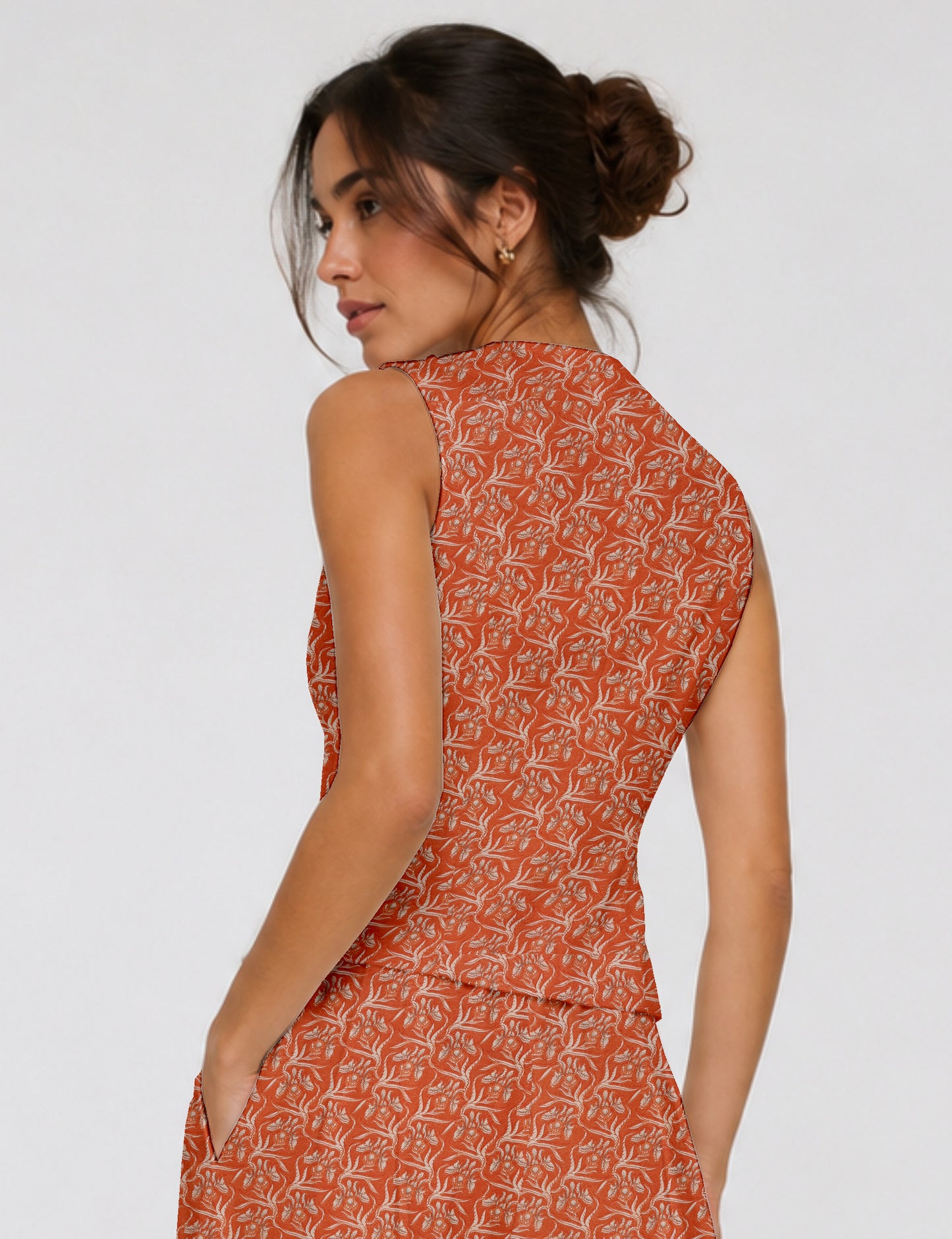 Women's fitted waistcoat with V-neck, single-breasted button closure, tailored silhouette, and pointed hem in sustainable fashion.