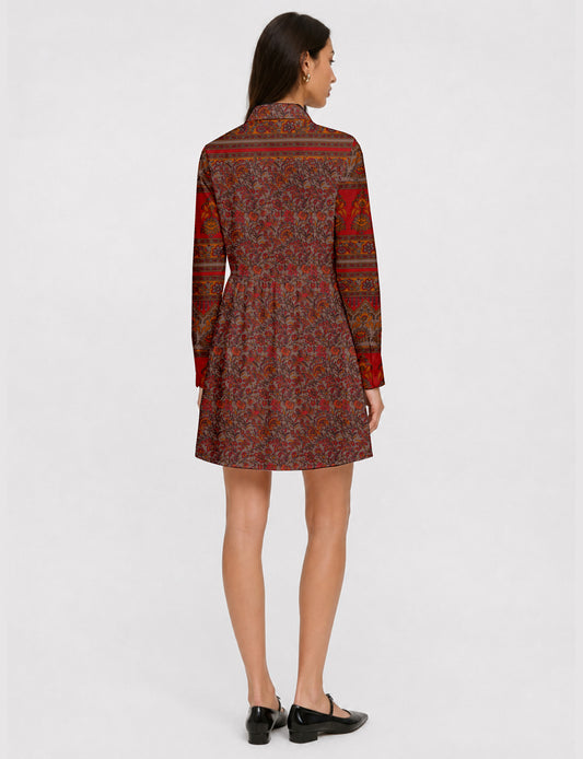 Short shirt dress with a relaxed A-line silhouette, point collar, partial button placket, gathered waist, side pockets, and full-length cuffed sleeves.