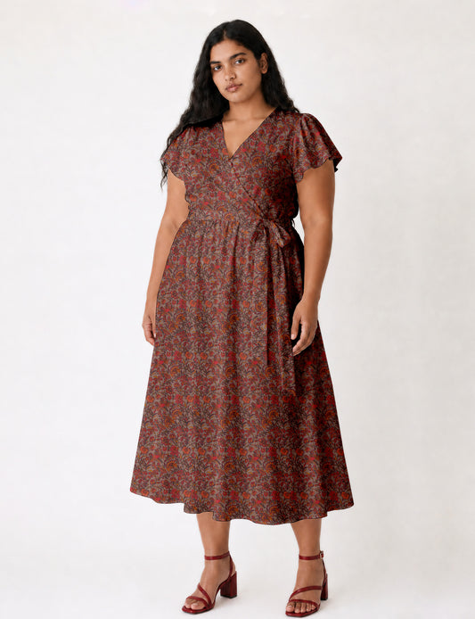 Elegant midi wrap dress with a V-neckline, adjustable waist tie, fitted bodice, and flared skirt for a timeless, flattering silhouette.