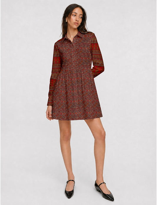 Short shirt dress with a relaxed A-line silhouette, point collar, partial button placket, gathered waist, side pockets, and full-length cuffed sleeves.