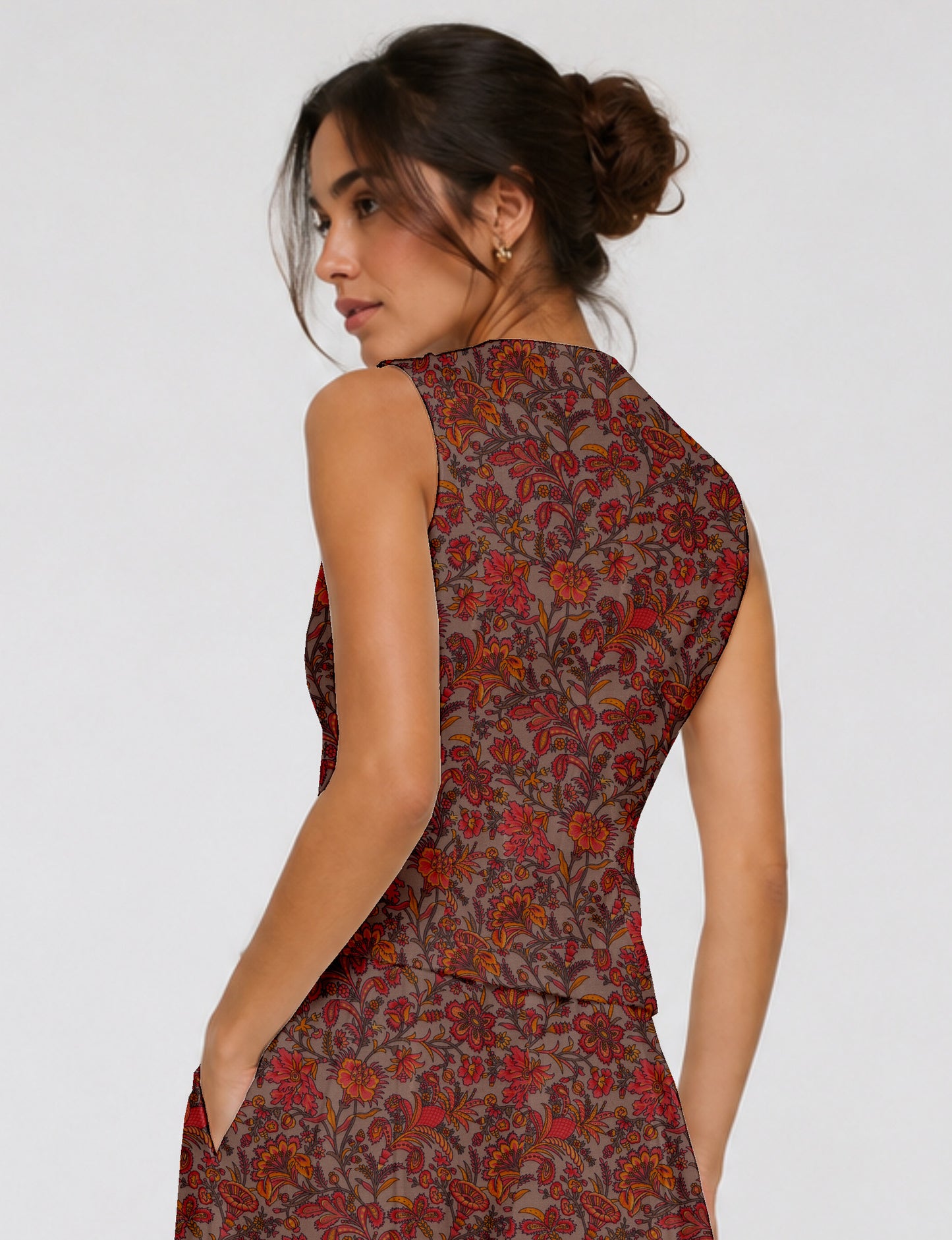 Women's fitted waistcoat with V-neck, single-breasted button closure, tailored silhouette, and pointed hem in sustainable fashion.
