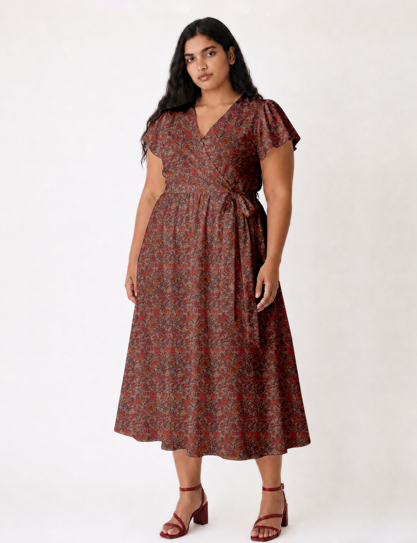 Elegant midi wrap dress with a V-neckline, adjustable waist tie, fitted bodice, and flared skirt for a timeless, flattering silhouette.