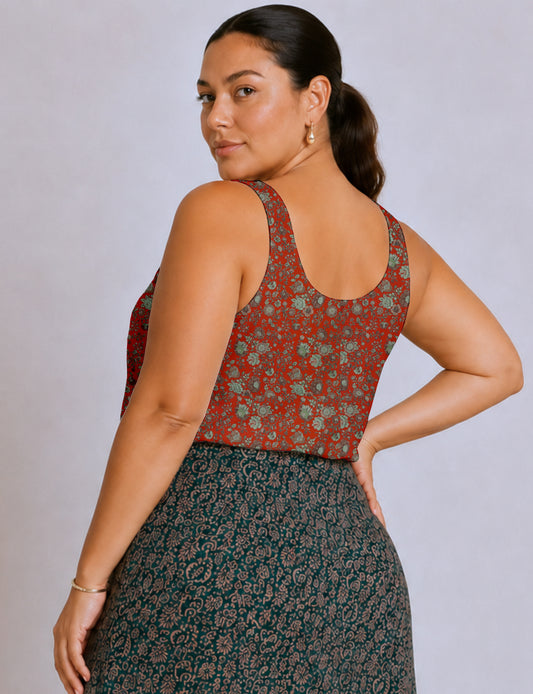 Women's sleeveless blouse with a relaxed straight fit, wide scoop neckline, deep scoop back, and hip-length silhouette.