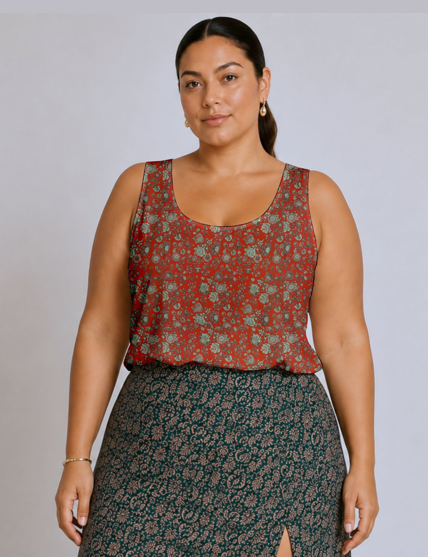 Women's sleeveless blouse with a relaxed straight fit, wide scoop neckline, deep scoop back, and hip-length silhouette.