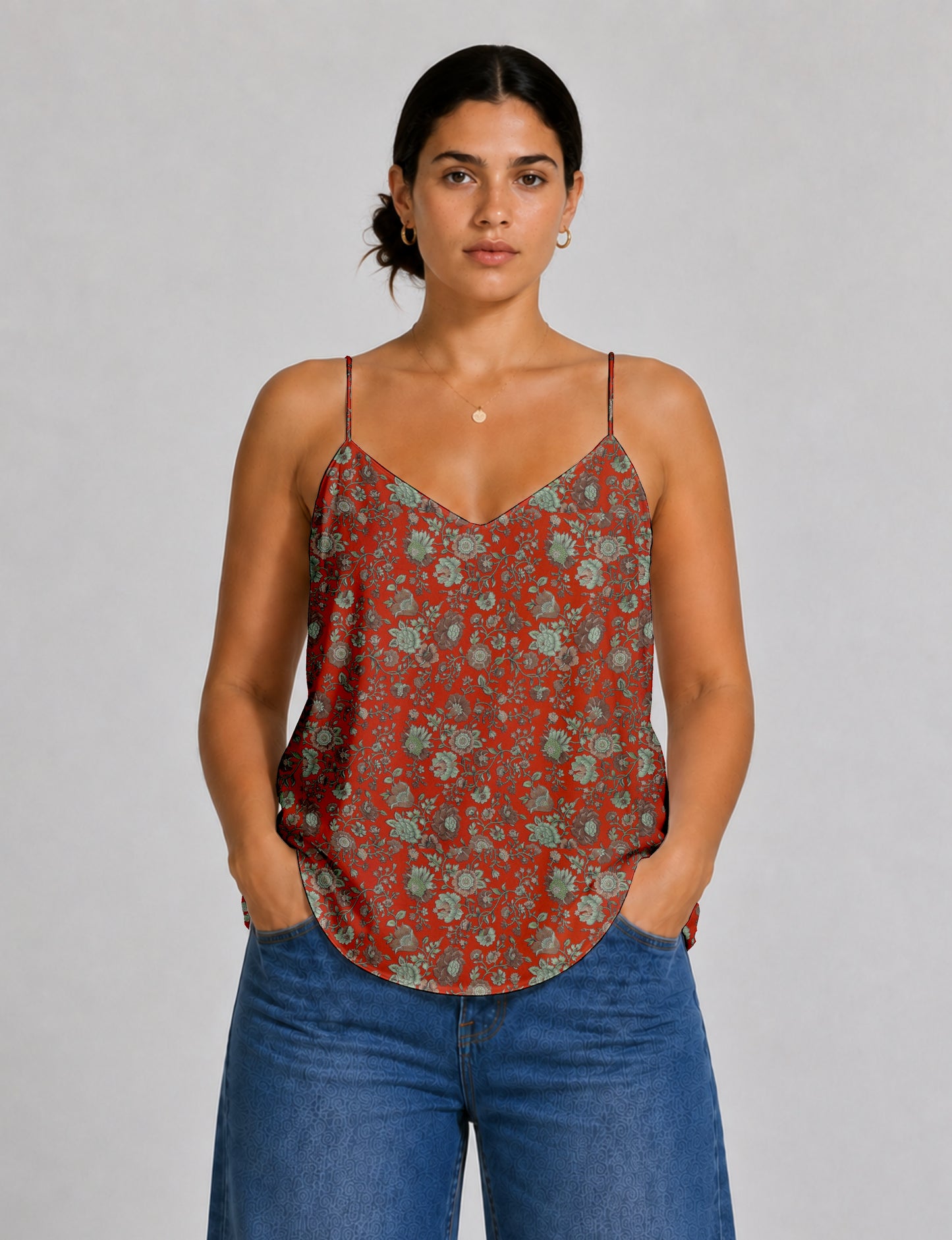 Women's sleeveless slip top with a relaxed straight fit, soft V-neckline, deep V-back, and delicate spaghetti straps.