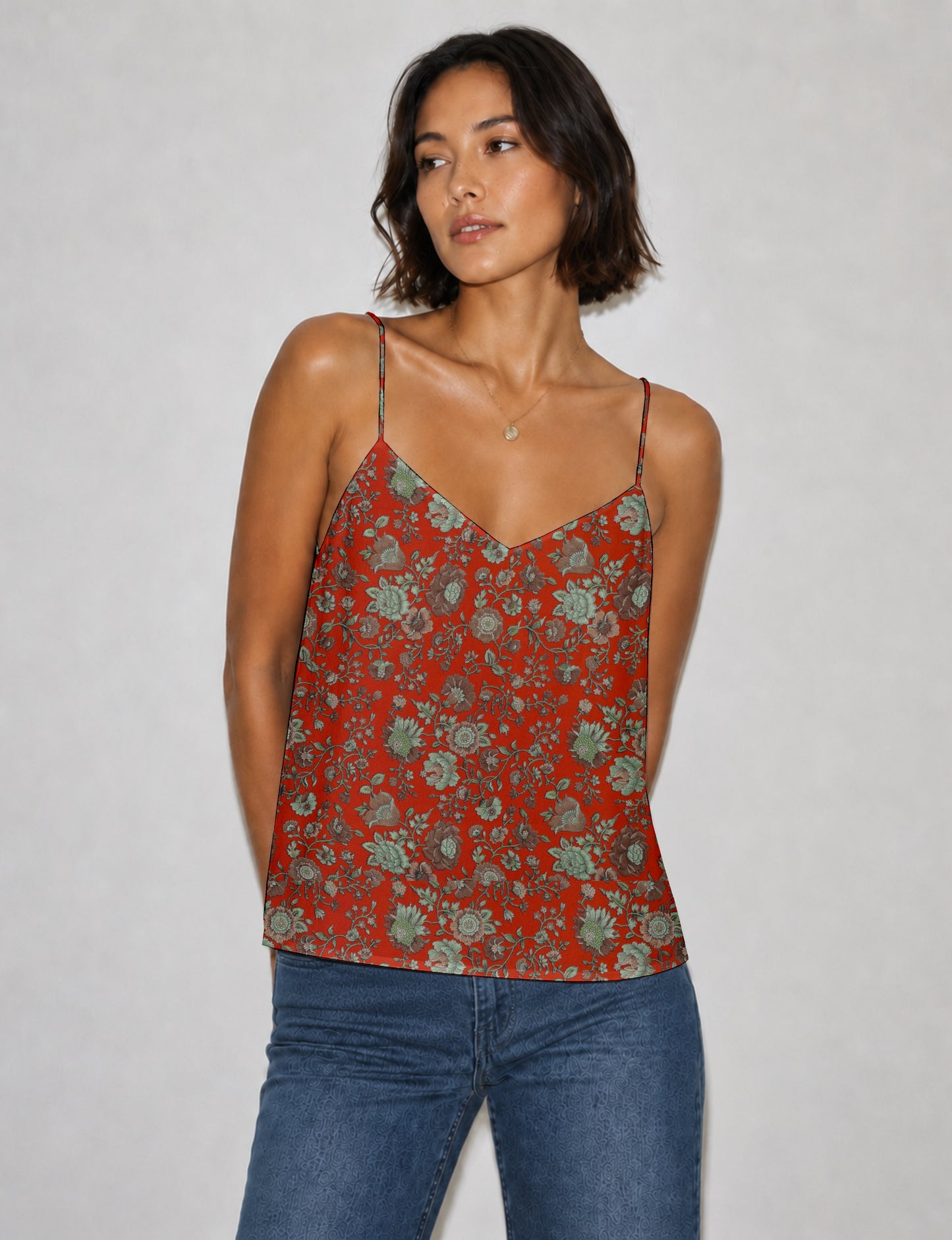 Women's sleeveless slip top with a relaxed straight fit, soft V-neckline, deep V-back, and delicate spaghetti straps.