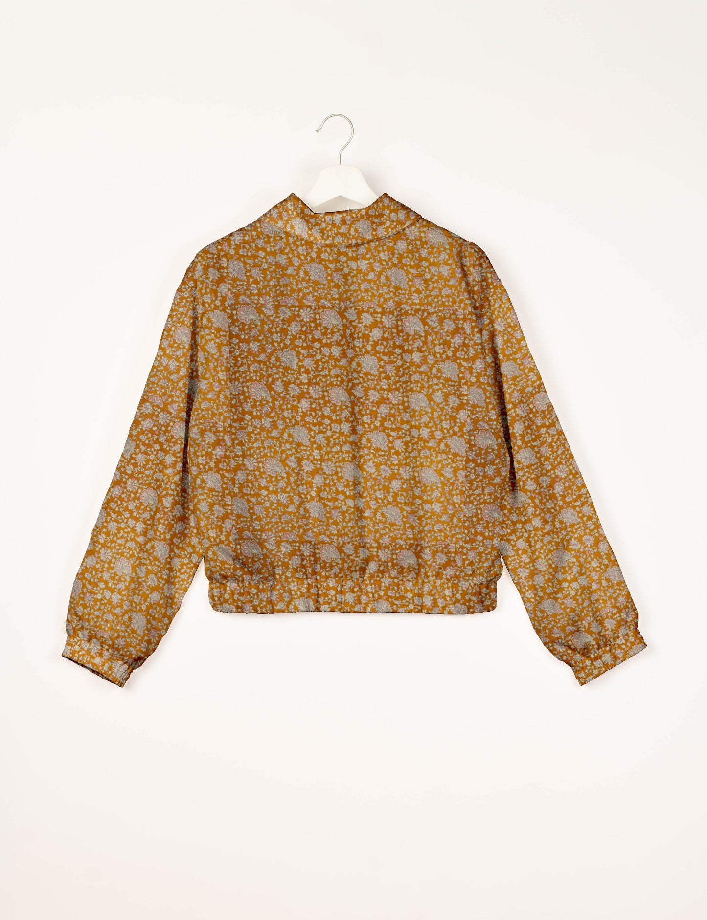 Orange floral patterned bomber jacket with elastic cuffs and waistband, shown from back on white hanger