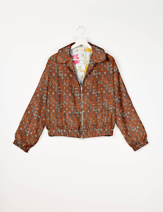 Upcycled Bomber Jacket made from recycled sari materials, featuring a cute cropped shape, elasticated hem and cuffs, and contrast sari print lining. Sustainable apparel promoting eco-friendly fashion and ethical clothing.