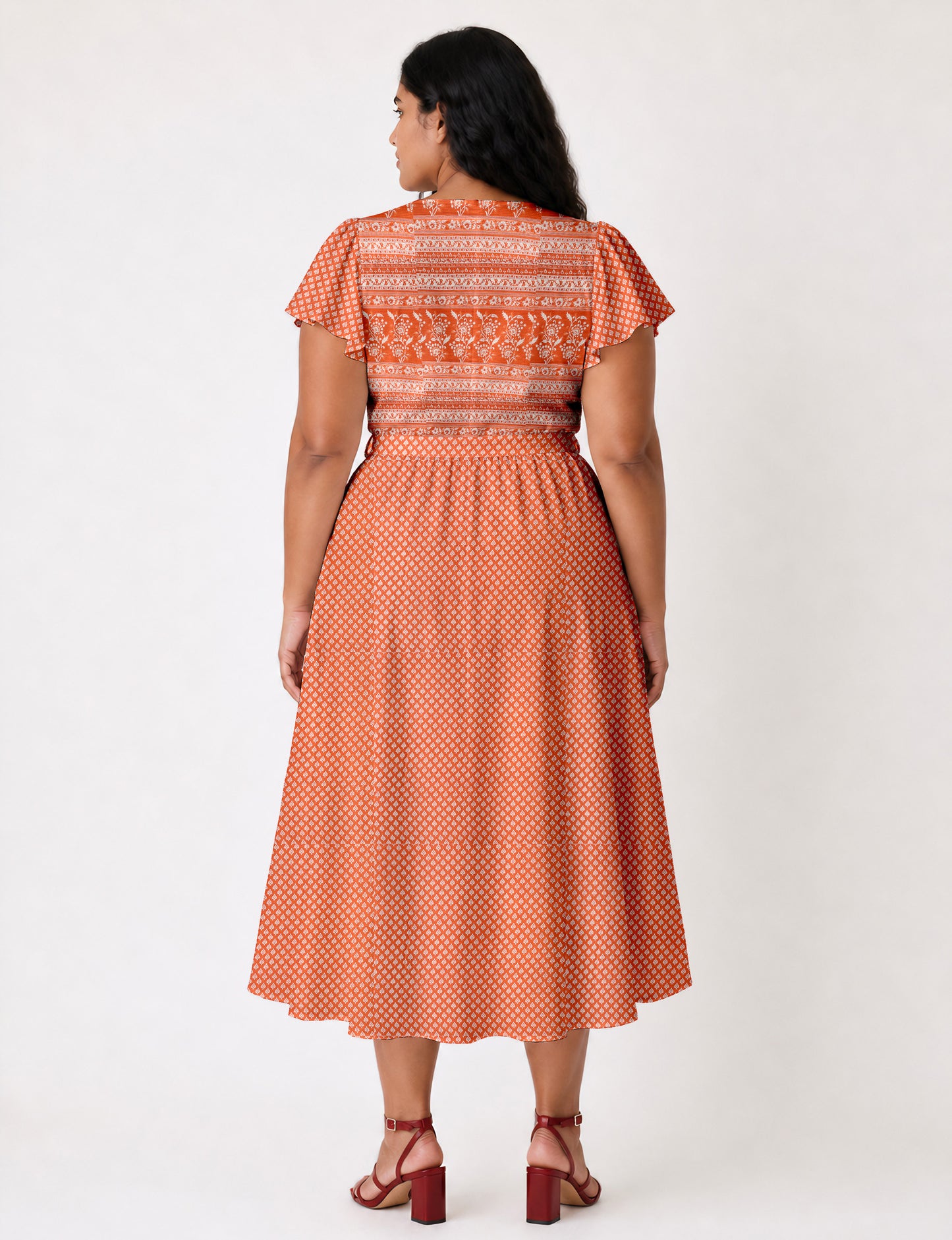 Elegant midi wrap dress with a V-neckline, adjustable waist tie, fitted bodice, and flared skirt for a timeless, flattering silhouette.