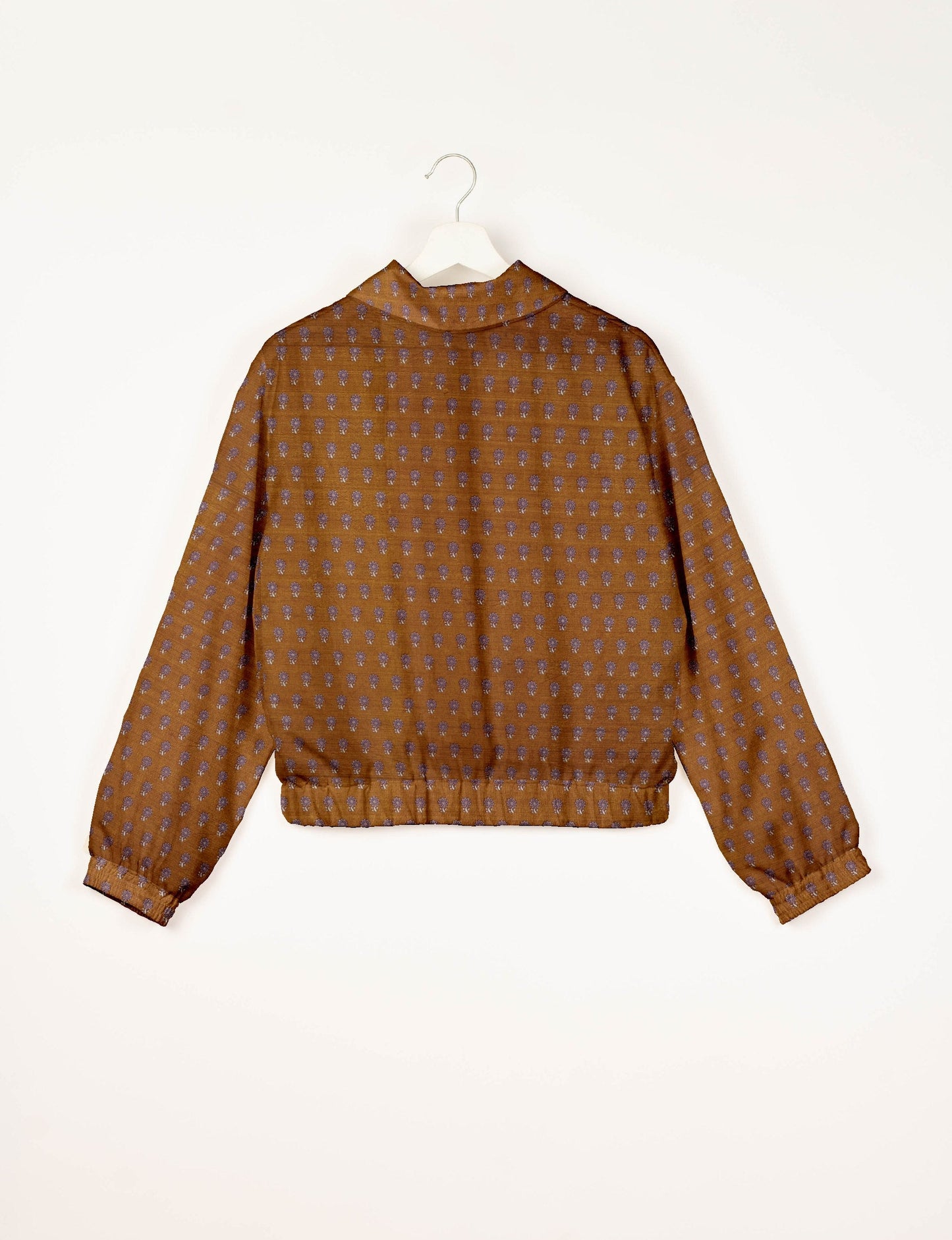 Upcycled Bomber Jacket made from recycled sari materials, featuring a cute cropped shape, elasticated hem and cuffs, and contrast sari print lining. Sustainable apparel promoting eco-friendly fashion and ethical clothing.