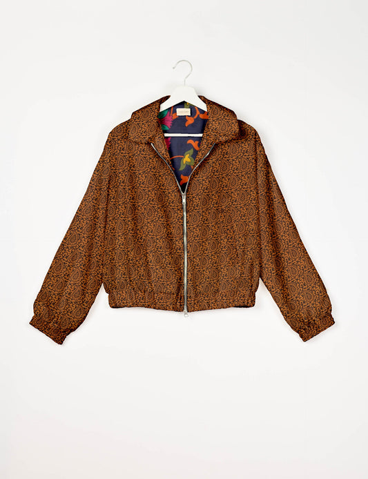 Upcycled Bomber Jacket made from recycled sari materials, featuring a cute cropped shape, elasticated hem and cuffs, and contrast sari print lining. Sustainable apparel promoting eco-friendly fashion and ethical clothing.