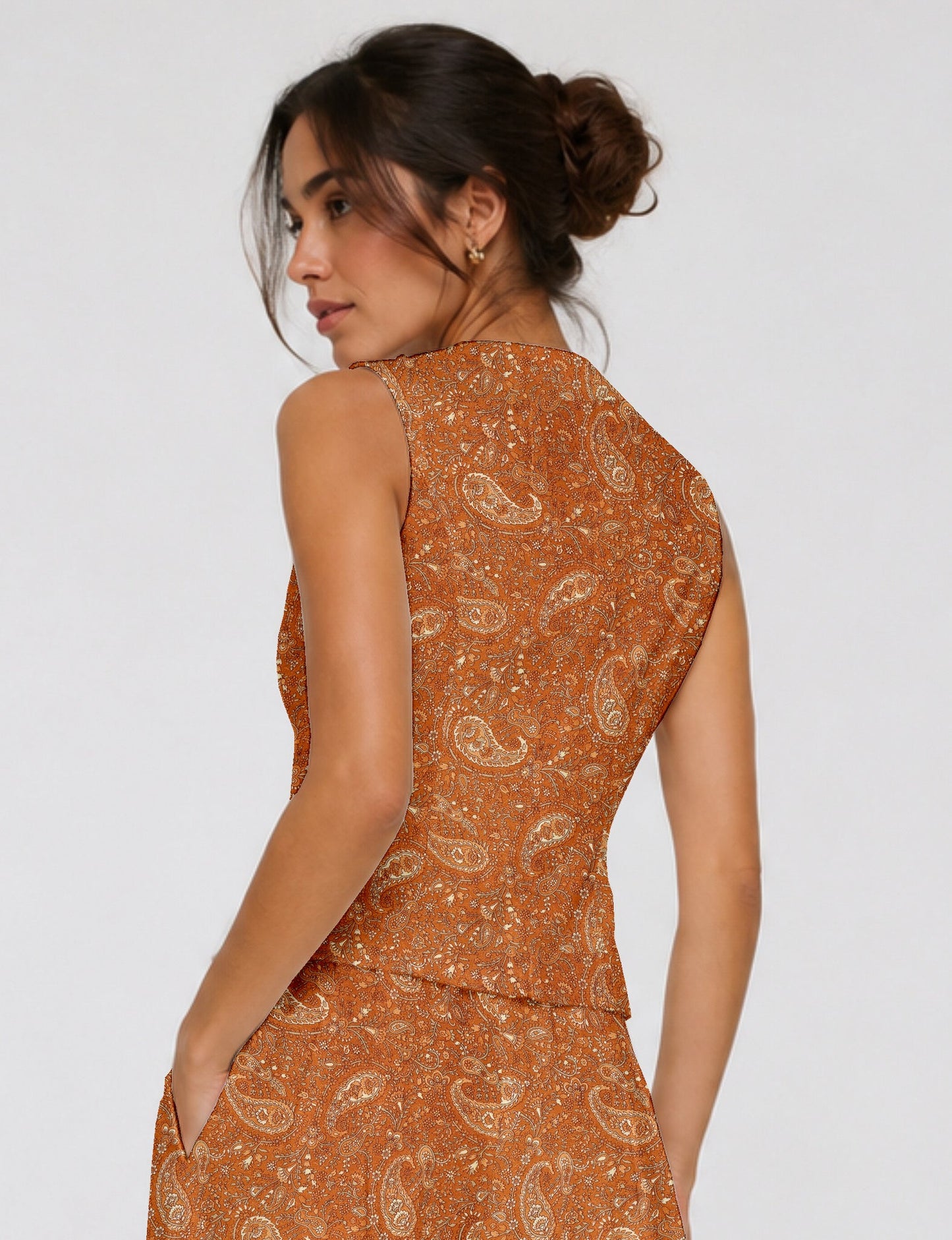 Women's fitted waistcoat with V-neck, single-breasted button closure, tailored silhouette, and pointed hem in sustainable fashion.