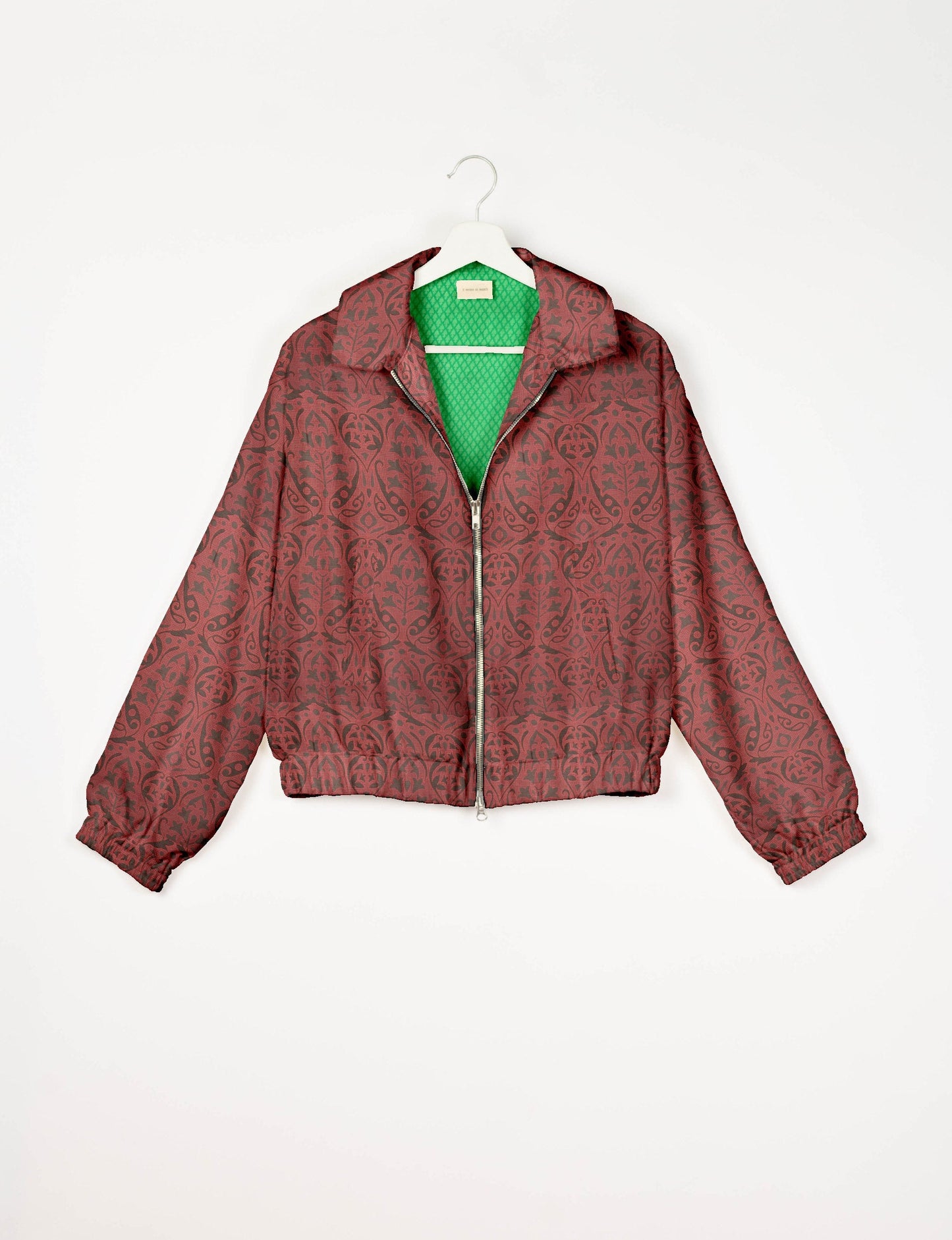 Upcycled Bomber Jacket made from recycled sari materials, featuring a cute cropped shape, elasticated hem and cuffs, and contrast sari print lining. Sustainable apparel promoting eco-friendly fashion and ethical clothing.