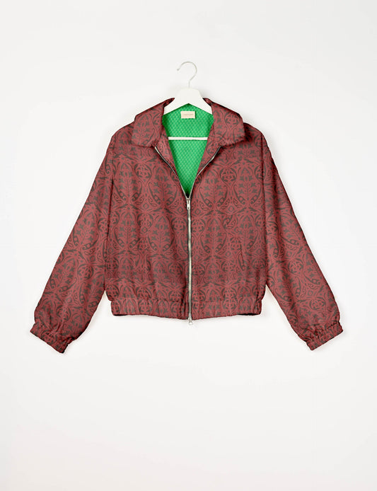 Upcycled Bomber Jacket made from recycled sari materials, featuring a cute cropped shape, elasticated hem and cuffs, and contrast sari print lining. Sustainable apparel promoting eco-friendly fashion and ethical clothing.