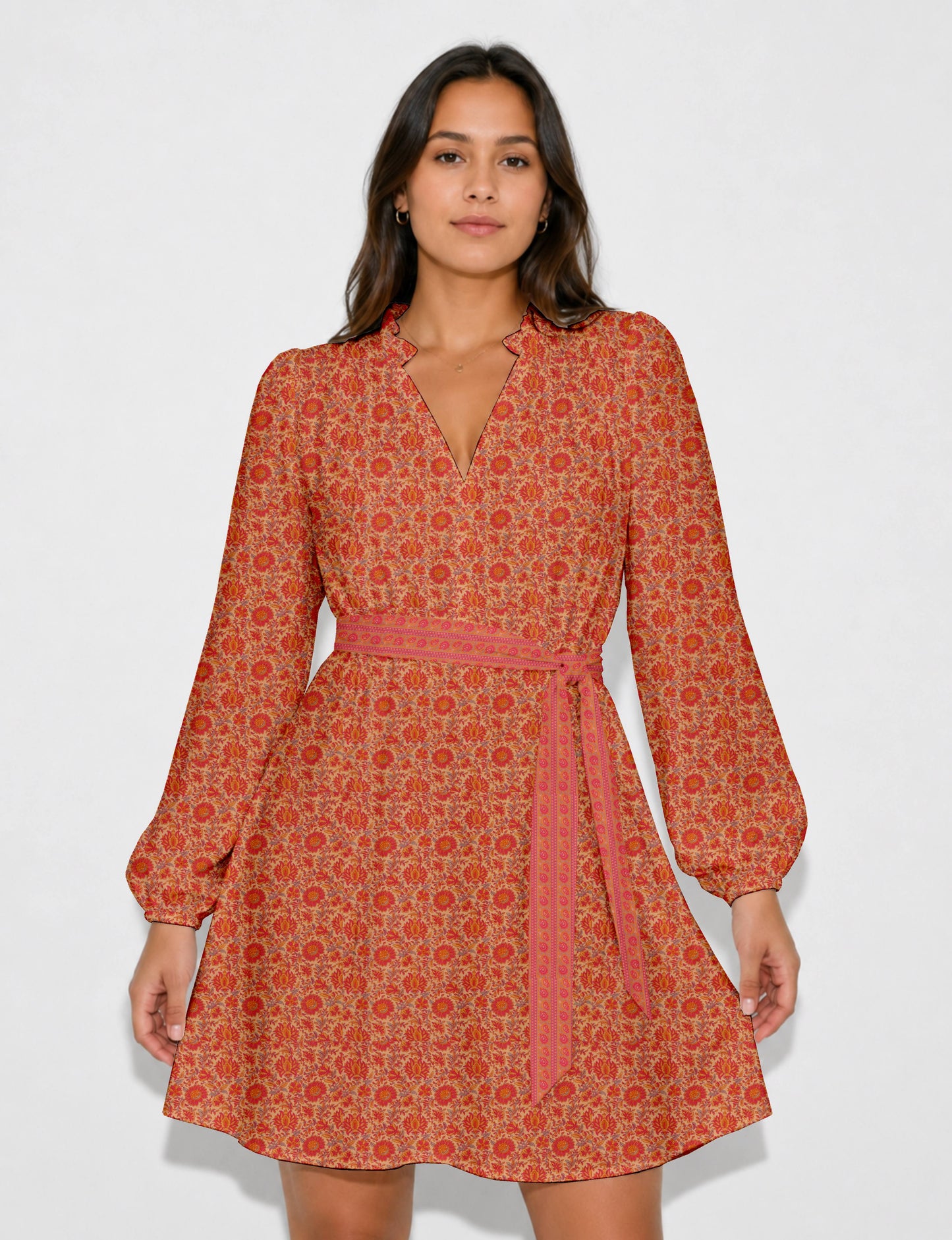 Swing dress with detachable tie belt, gathered ruffle neckline, full-length voluminous sleeves, elastic cuffs, and relaxed A-line silhouette in an above-knee length.