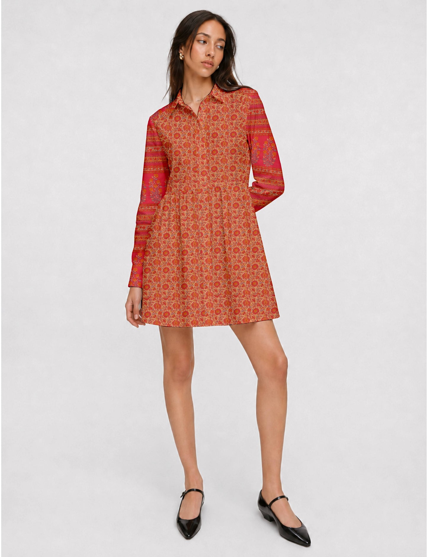 Short shirt dress with a relaxed A-line silhouette, point collar, partial button placket, gathered waist, side pockets, and full-length cuffed sleeves.