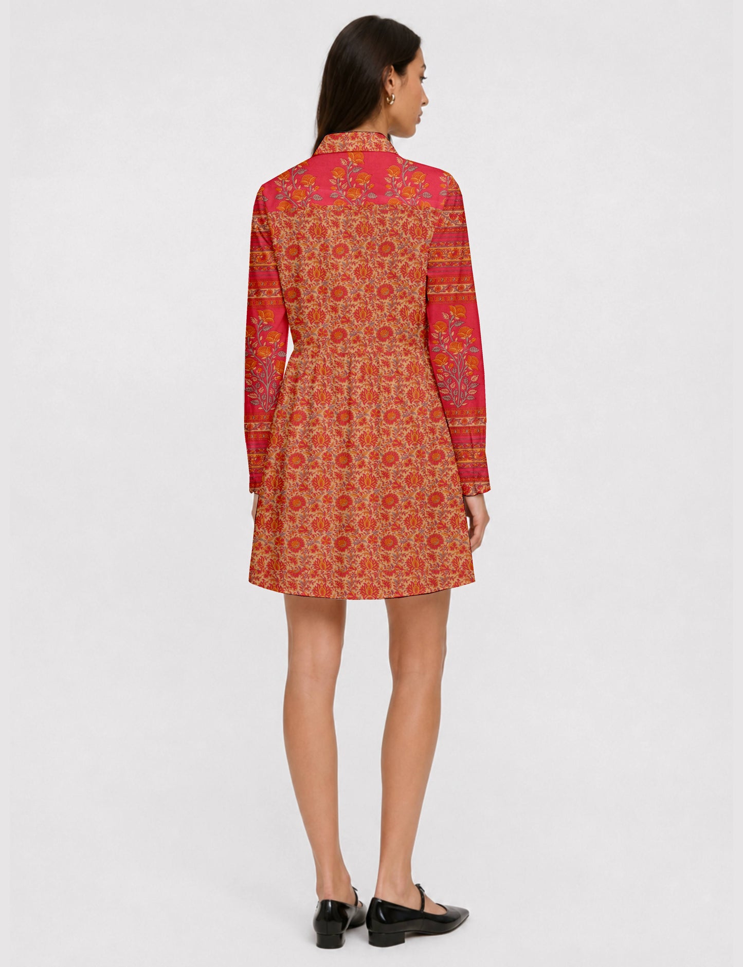 Short shirt dress with a relaxed A-line silhouette, point collar, partial button placket, gathered waist, side pockets, and full-length cuffed sleeves.