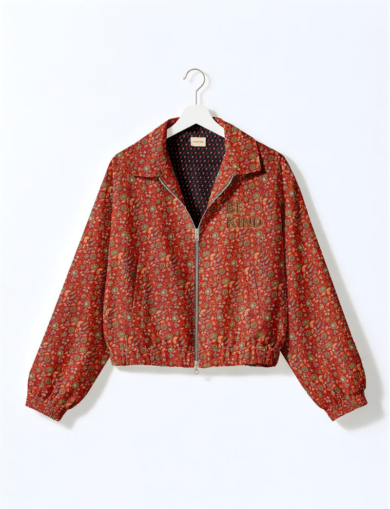 BE KIND Bomber jacket made from upcycled sari fabric with handcrafted Aari embroidery by female artisans.