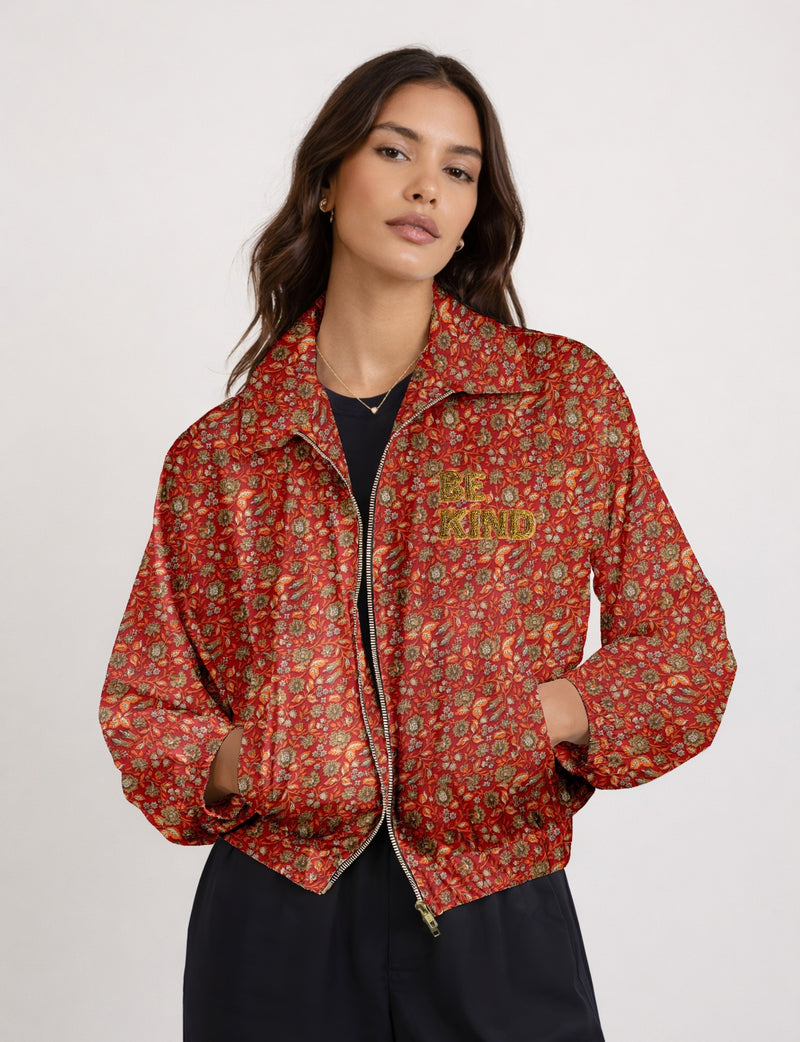 BE KIND Bomber jacket made from upcycled sari fabric with handcrafted Aari embroidery by female artisans.