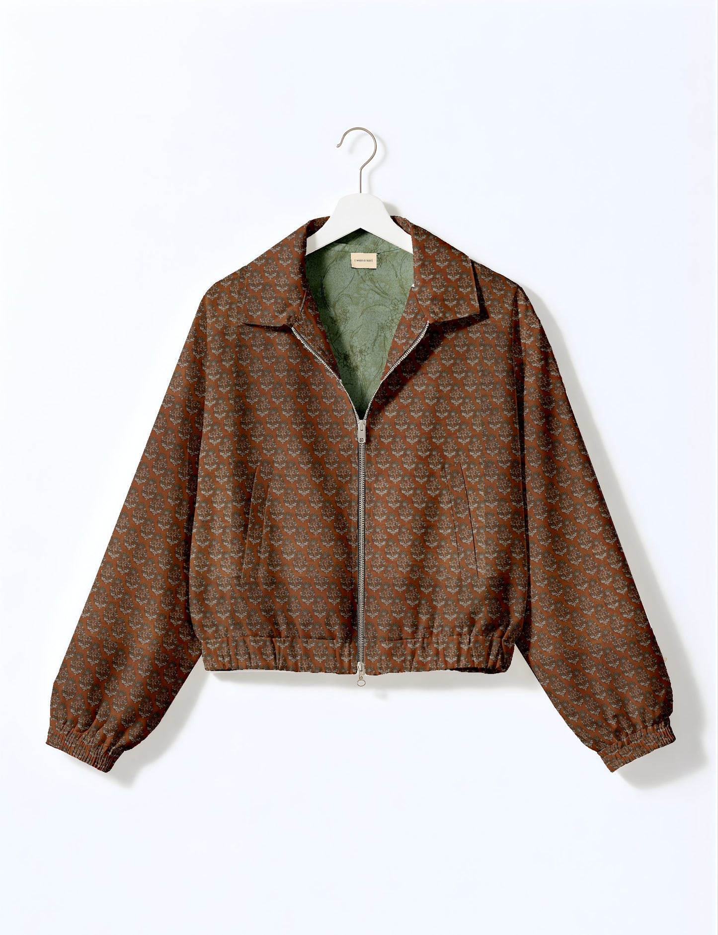 Upcycled Bomber Jacket made from recycled sari materials, featuring a cute cropped shape, elasticated hem and cuffs, and contrast sari print lining. Sustainable apparel promoting eco-friendly fashion and ethical clothing.